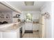 Kitchen view with white cabinetry, countertops, and stainless steel appliances at 3335 Woodcrest Ct, Columbus, IN 47203