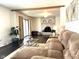 Bright living room featuring a cozy fireplace, hardwood floors, and sliding glass doors at 3335 Woodcrest Ct, Columbus, IN 47203