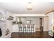 Inviting living room with brick fireplace and bar seating open to the kitchen with white cabinetry at 3335 Woodcrest Ct, Columbus, IN 47203