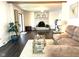 Cozy living room featuring a brick fireplace, hardwood floors, and an open floor plan at 3335 Woodcrest Ct, Columbus, IN 47203