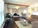 Spacious living room featuring a brick fireplace, hardwood floors, and open layout at 3335 Woodcrest Ct, Columbus, IN 47203