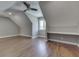 Versatile attic space with a built-in desk and large window providing plenty of natural light at 4140 Sagewood Ct, Greenwood, IN 46143