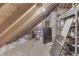 Unfinished attic space with exposed rafters and insulation, ready for customization at 4140 Sagewood Ct, Greenwood, IN 46143
