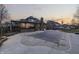 Home's expansive backyard features an in-ground pool, patio, and lush greenery, perfect for entertaining at 4140 Sagewood Ct, Greenwood, IN 46143