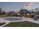 Backyard with a covered pool, patio, and lush landscaping, creating a private retreat at 4140 Sagewood Ct, Greenwood, IN 46143