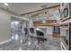 Modern bar with stainless steel appliances and a rustic wood backsplash design at 4140 Sagewood Ct, Greenwood, IN 46143