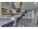 Entertainment bar with unique countertop, stainless steel ceiling, and built-in microwave at 4140 Sagewood Ct, Greenwood, IN 46143