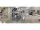 Finished basement offers a ping pong table and comfortable seating area with a mounted television at 4140 Sagewood Ct, Greenwood, IN 46143