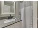 Bathroom featuring granite counters, tile shower, and white trim at 4140 Sagewood Ct, Greenwood, IN 46143