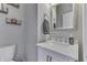 Bright bathroom with a white vanity, silver fixtures, and decorative shelving for a modern aesthetic at 4140 Sagewood Ct, Greenwood, IN 46143