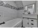 Stylish bathroom featuring a tub, tiled walls, and a vanity with storage at 4140 Sagewood Ct, Greenwood, IN 46143