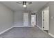 Spacious bedroom featuring soft gray carpet, a ceiling fan, and neutral walls at 4140 Sagewood Ct, Greenwood, IN 46143