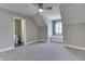 Cozy bedroom with neutral walls, gray carpet, and a window bench with natural light at 4140 Sagewood Ct, Greenwood, IN 46143
