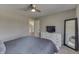 Bedroom with ceiling fan, white trim, and lots of natural light at 4140 Sagewood Ct, Greenwood, IN 46143