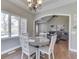 Bright breakfast nook with a wood table and a view of the living room at 4140 Sagewood Ct, Greenwood, IN 46143