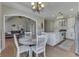 Sunlit breakfast nook is open to the kitchen and living room with hardwood floors at 4140 Sagewood Ct, Greenwood, IN 46143