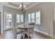 Cozy breakfast nook with hardwood floors, a chandelier, and natural light at 4140 Sagewood Ct, Greenwood, IN 46143