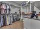 A large closet with clothing racks, shelving, and a granite countertop at 4140 Sagewood Ct, Greenwood, IN 46143
