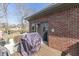 Home exterior and deck with a grill, overlooking a spacious backyard with neighboring houses in a landscaped community at 4140 Sagewood Ct, Greenwood, IN 46143