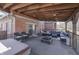 A covered deck offers comfortable seating with views of a hot tub and the expansive backyard and neighborhood beyond at 4140 Sagewood Ct, Greenwood, IN 46143
