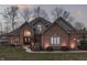 Charming brick home with manicured lawn, beautiful windows and inviting entryway at 4140 Sagewood Ct, Greenwood, IN 46143