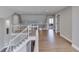 Hallway features wood floors, white railing, and natural light at 4140 Sagewood Ct, Greenwood, IN 46143