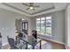 Home office with a tray ceiling, bright window and a view of the front yard at 4140 Sagewood Ct, Greenwood, IN 46143