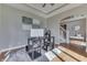 Bright home office space featuring hardwood floors, grey walls, and an open doorway at 4140 Sagewood Ct, Greenwood, IN 46143