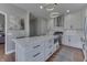Bright kitchen features a large center island with white marble countertops and modern stainless steel appliances at 4140 Sagewood Ct, Greenwood, IN 46143