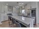 Modern kitchen with white cabinets, stainless steel appliances, and a large island at 4140 Sagewood Ct, Greenwood, IN 46143