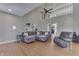 Open living room with high ceilings, hardwood floors, and grey contemporary furniture at 4140 Sagewood Ct, Greenwood, IN 46143