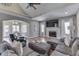 Spacious living room with a fireplace, vaulted ceiling, and an open doorway at 4140 Sagewood Ct, Greenwood, IN 46143