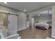 Spacious main bedroom has hardwood floors, a side sitting area, barn door to bath, and tray ceiling at 4140 Sagewood Ct, Greenwood, IN 46143