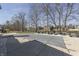 A wide view of the covered in-ground pool with a large grassy backyard and lounge furniture in the background at 4140 Sagewood Ct, Greenwood, IN 46143