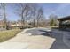 Backyard in the daytime featuring a covered in-ground pool with beautiful landscaping and mature trees surrounding the property at 4140 Sagewood Ct, Greenwood, IN 46143