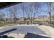 Overhead view of the covered in-ground pool in a landscaped backyard, with lounge furniture and houses in the distance at 4140 Sagewood Ct, Greenwood, IN 46143