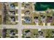 Overhead aerial view of a residential neighborhood near a scenic pond and beach area at 4347 Westminster Pl, Columbus, IN 47201