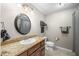 Bathroom features granite countertop, cherry vanity, and modern fixtures at 4347 Westminster Pl, Columbus, IN 47201