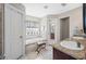 Bathroom featuring a bathtub, vanity with granite countertop, and stylish fixtures at 4347 Westminster Pl, Columbus, IN 47201