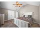 Vaulted ceiling bedroom with carpet, ceiling fan, and a neutral color scheme at 4347 Westminster Pl, Columbus, IN 47201