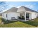 Exterior view of a white single-Gathering home with a covered patio at 4347 Westminster Pl, Columbus, IN 47201