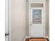 Bright entryway featuring a decorative glass door, hardwood floors, and elegant trim at 4347 Westminster Pl, Columbus, IN 47201