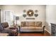 Cozy living room featuring a comfortable sofa, decorative wall art, and warm, inviting decor at 4347 Westminster Pl, Columbus, IN 47201