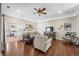 Comfortable living room featuring hardwood floors, tray ceilings, and neutral decor at 4347 Westminster Pl, Columbus, IN 47201