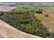 Aerial view of farmland with pond and wooded areas surrounding a home at 4491 N 75 W, Franklin, IN 46184