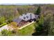 Expansive brick home with manicured lawn and lush surrounding trees at 4491 N 75 W, Franklin, IN 46184