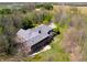 Aerial view of brick home showcasing backyard deck and green lawn at 4491 N 75 W, Franklin, IN 46184