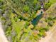Overhead aerial view of house with dock and pond on a wooded lot at 4491 N 75 W, Franklin, IN 46184