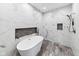 Modern bathroom with a free-standing tub and stylish marble tile throughout at 4491 N 75 W, Franklin, IN 46184
