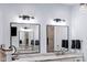 Bright bathroom featuring dual sinks with a stone countertop, modern fixtures, and ample vanity space at 4491 N 75 W, Franklin, IN 46184